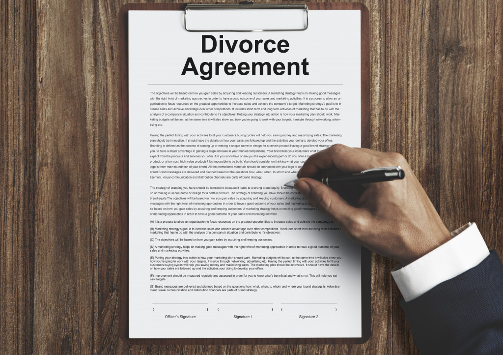 divorce agreement document being signed by lawyer